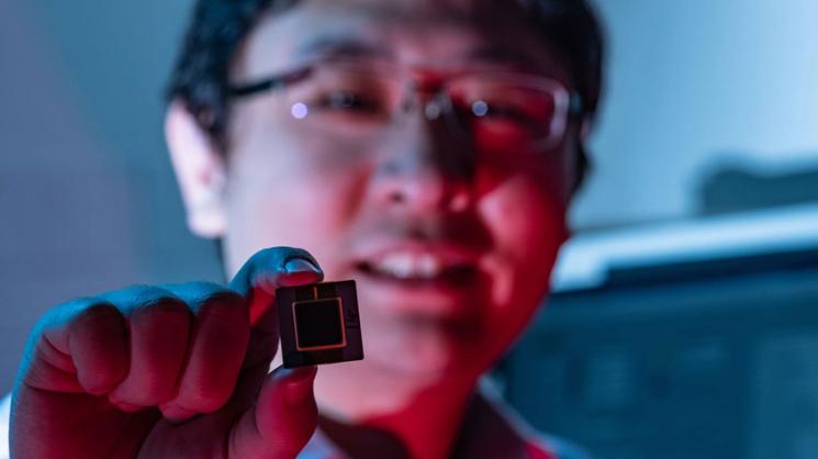 Rice University integrated circuit designer Kaiyuan Yang with a prototype of a new device that is 10 times more reliable than current methods of producing unclonable digital fingerprints for Internet of Things (IoT) devices. (Photo by Jeff Fitlow/Rice)